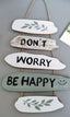 Dekoratives Wandpaneel „Don't Worry Be Happy“.