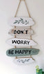 Dekoratives Wandpaneel „Don't Worry Be Happy“.