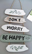 Dekoratives Wandpaneel „Don't Worry Be Happy“.